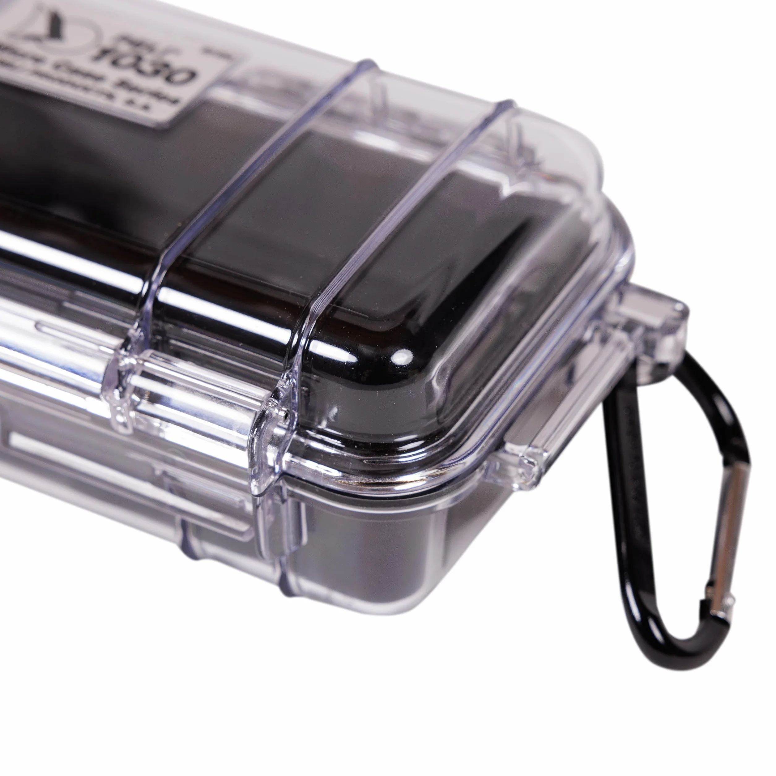 PELI 1030 Mała skrzynia podróżna na urządzenia elektroniczne, wodoszczelna i pyłoszczelna (IP67), pojemność 0,6 l, wyprodukowana w USA, przezroczysta/czarna wkładka